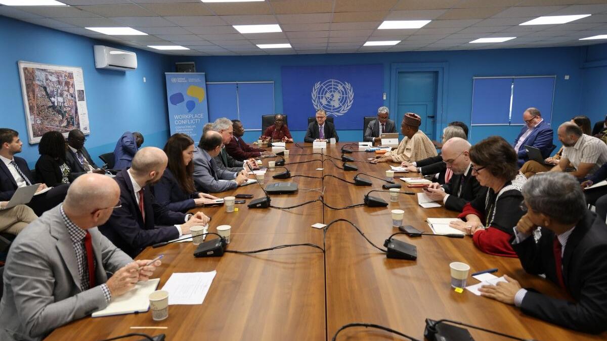 On the final day of his visit to #SouthSudan, UN Peacekeeping Chief, Jean-Pierre Lacroix, stressed the full commitment of #UNMISS to protecting civilians and supporting the peace process, despite new constraints caused by the UN-wide financial crisis. Meeting in a UN conference room with participants seated around a long wooden table, microphones and notebooks in front of them, and a UN emblem on the blue wall