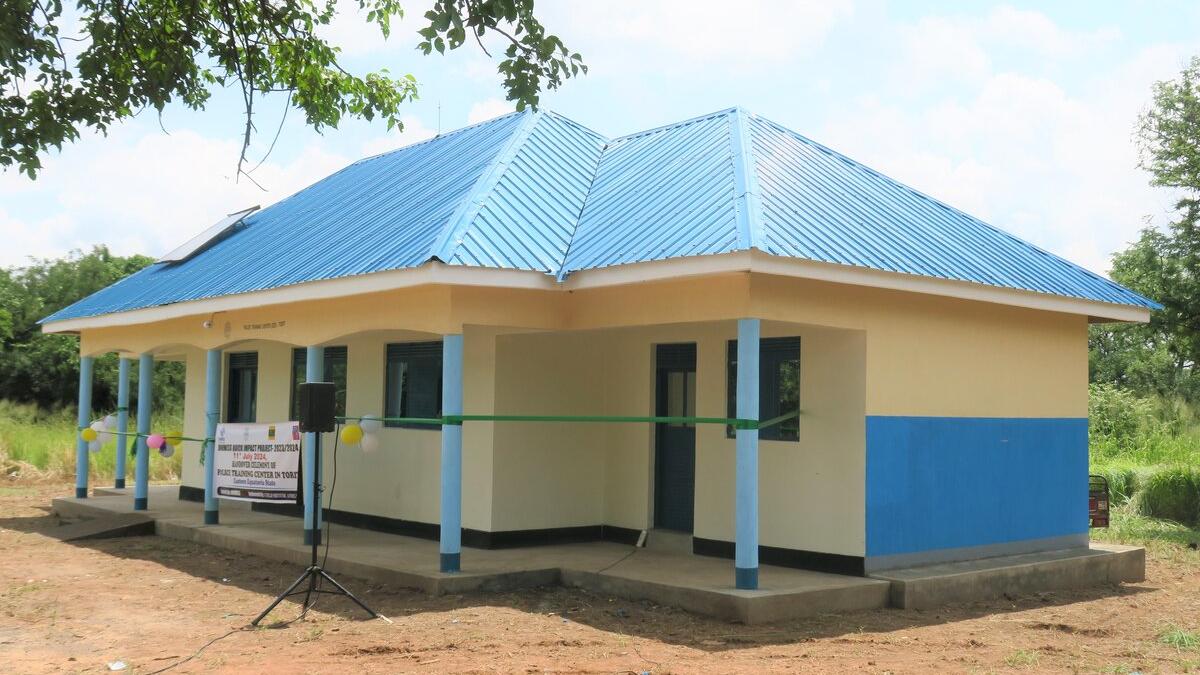 A yellow building with a blue roof
