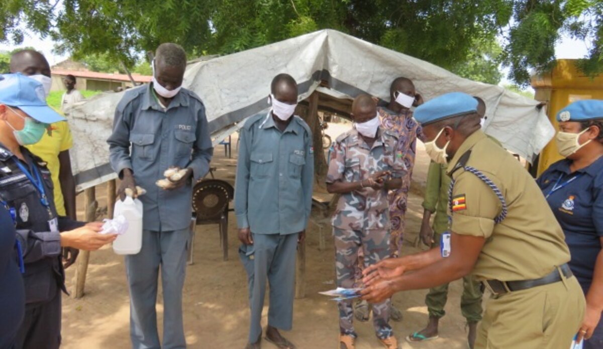 UN police officers in Rumbek distribute face masks and soap to South Sudanese colleagues