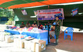 Bangladeshi peacekeepers hand over books and sports items to primary school children