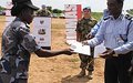 Police graduate from munitions course, urged to protect civilians