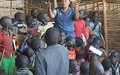 UN Police officer talks to children in protection site