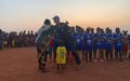 UNMISS police officer from Sweden initiates fundraiser, hands over sports gear to hundreds of youths