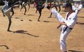 South Koreans teach students taekwondo, football