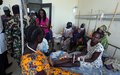 UNMISS staff members donate food and clothes at a women’s hospital in Rumbek