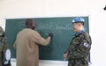 UNMISS peacekeepers from South Korea hand over educational material to students in Jonglei