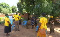 Local women in Yambio use UNMISS-produced information material to raise awareness on COVID-19
